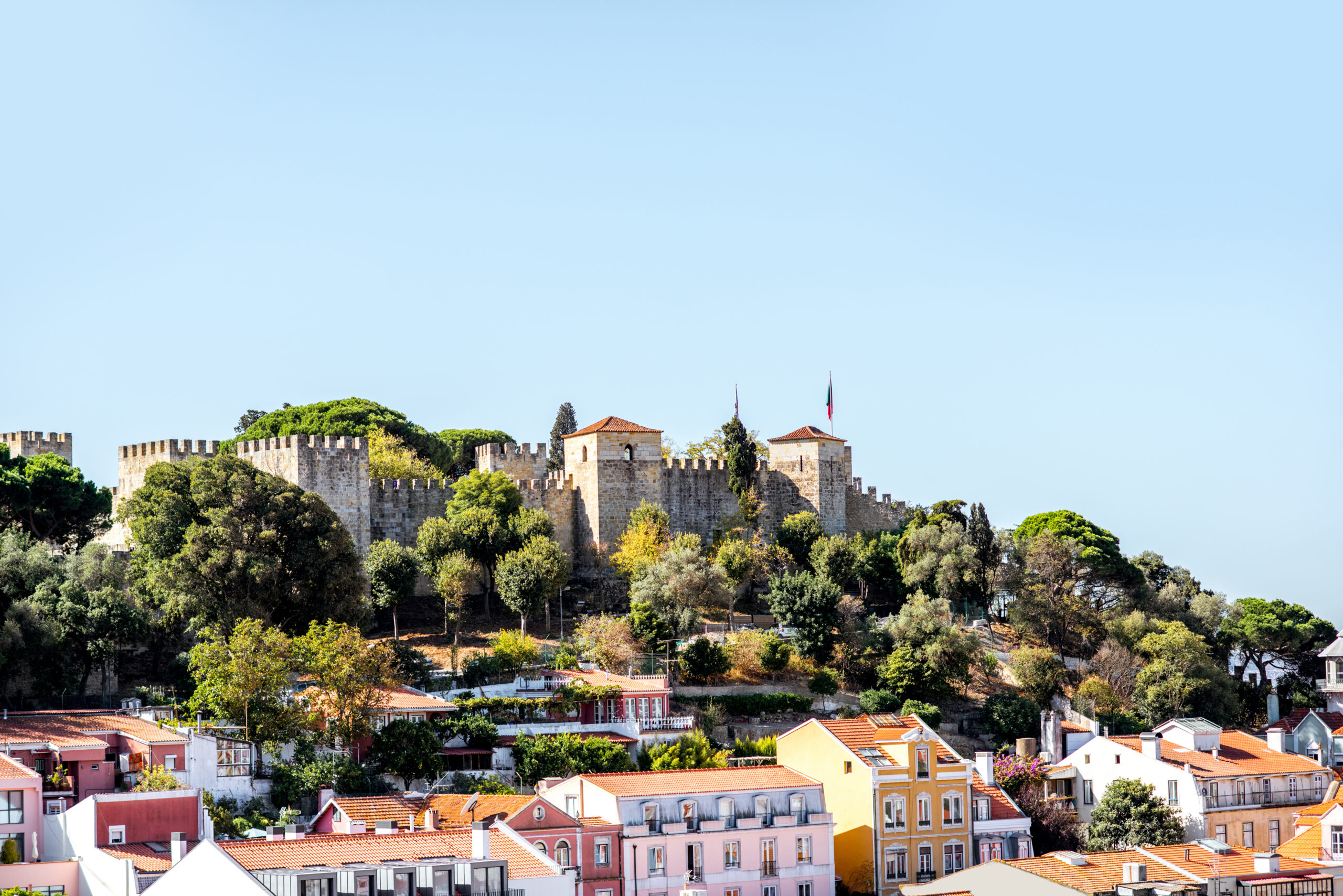 Cityscape view on the old town with castle hill during the sunny day in Lisbon city, Portugal